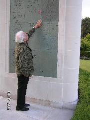 Panel 26 at Brookwood Memorial Cemetry where Violette Szabo GC is inscribed. Paul-Emile points to her name under the poppy